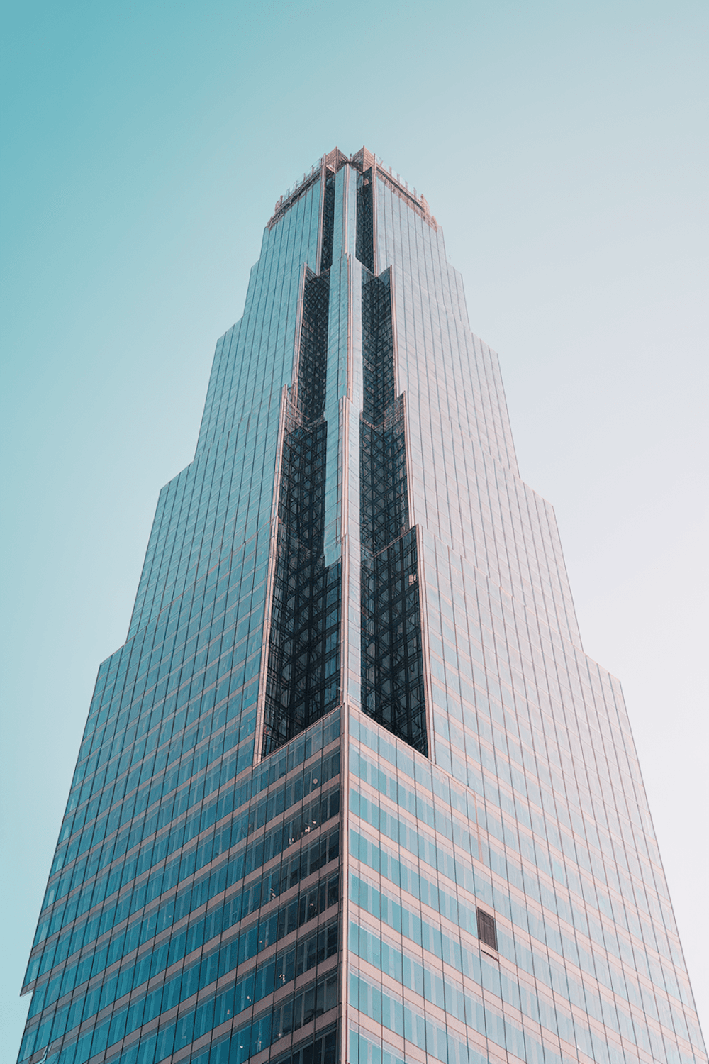 Glass resort tower reflecting the sky